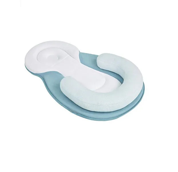 Anti rollover pillow in green and white on white background
