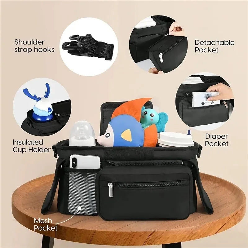 Black stroller bag on a wood table with various compartments and features highlighted on a beige background