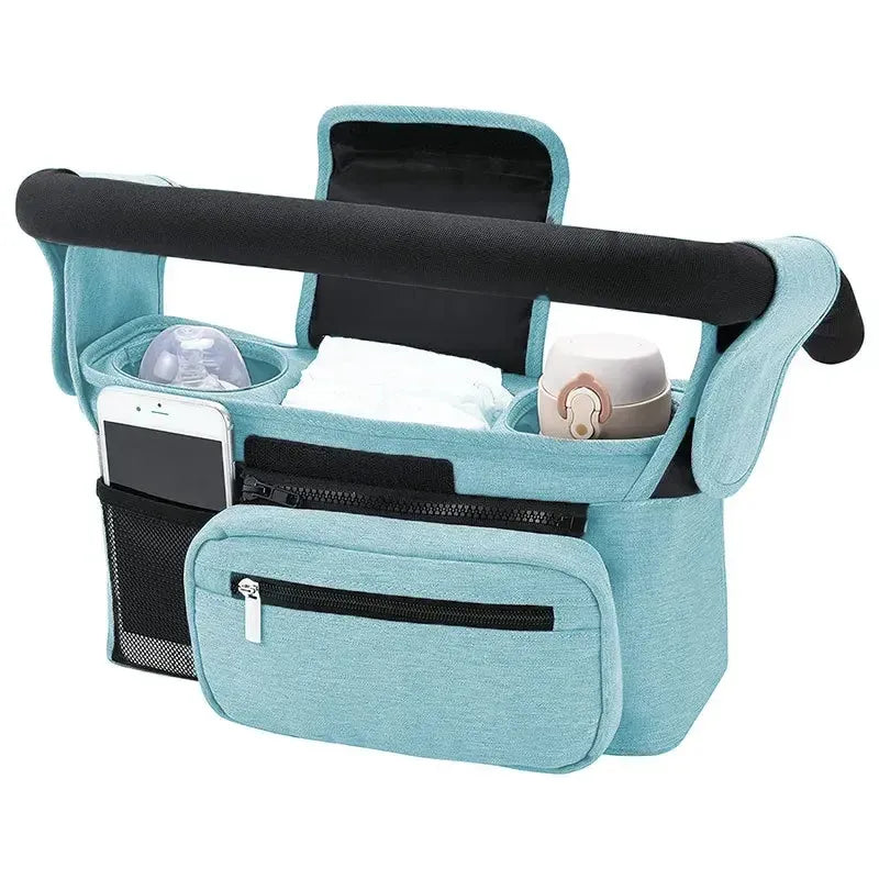 Teal stroller organizer with cup holders and phone pocket on a white 