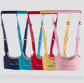 Set of four colorful baby walking aids with straps on a white background