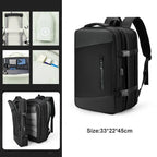 Black backpack with multiple compartments and a size label on a white background