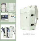Light green backpack with multiple compartments and a size label on a white background