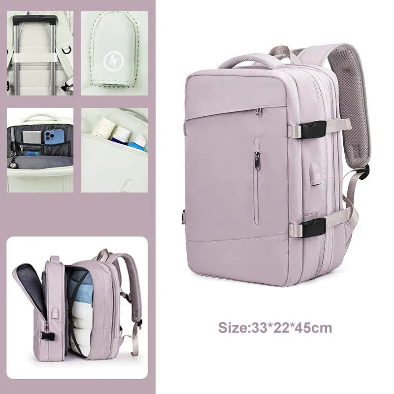 Pink backpack with multiple compartments and a size label on a white background
