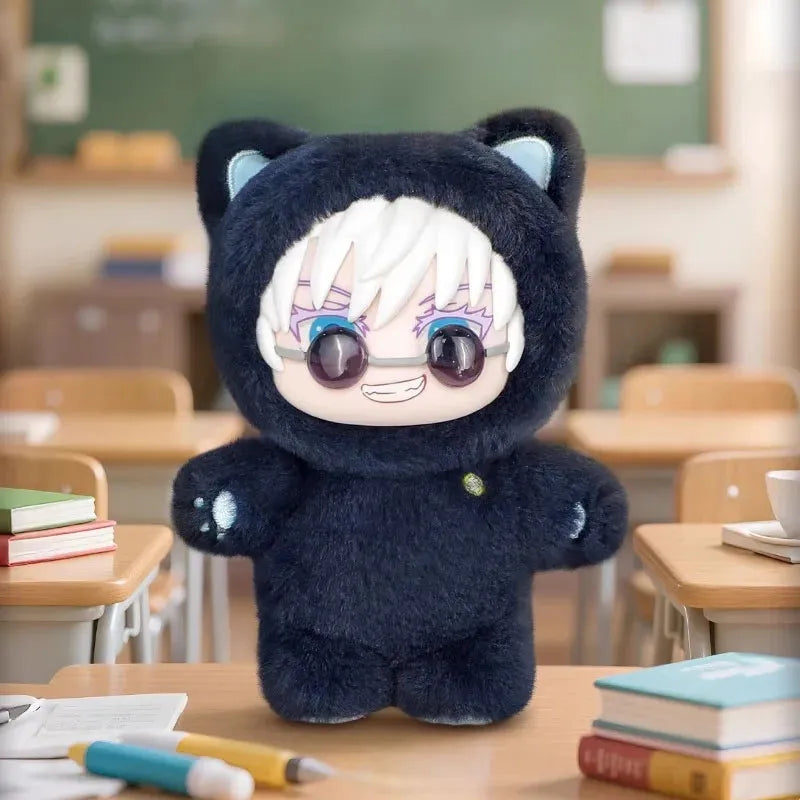 Black plush toy with cartoon face on a classroom desk