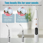Dental tool with two head options and a wrench for changing heads on a blurred background.