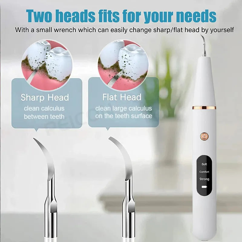 Dental tool with two head options and a wrench for changing heads on a blurred background.