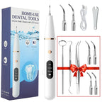 Home-use dental tools set with electric tooth cleaner, packaging, and additional tools.