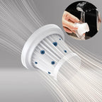 White vacuum filter being washed under a tap