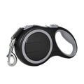 Black retractable dog leash with silver clip on a white background