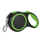 Black and green retractable dog leash on a white background