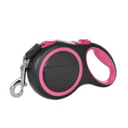 Black and pink retractable dog leash on a white background