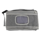Gray portable changing pad on white background
