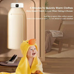 Baby wrapped in a yellow towel with duck design, sitting by a  hanging portable dryer