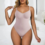 Woman wearing a light pink bodysuit in a minimalistic setting