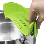 Demonstration of using a clip-on silicon strainer on steel pot 