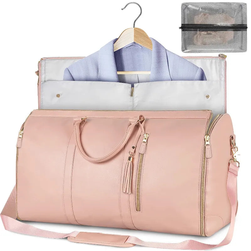 Pink  travel bag with a blue shirt on a hanger and a clear pouch inside.