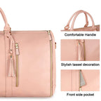 Pink folding suit bag with handles, tassels and front pocket on a white background