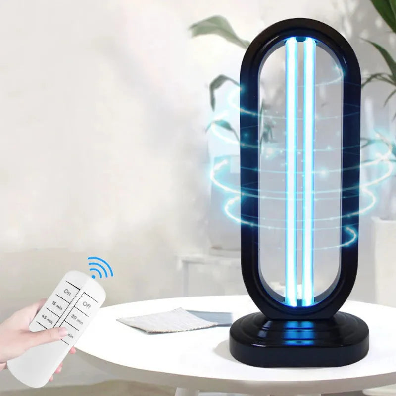 Ultraviolet light sterilizer on a table with a remote control