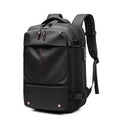 Black vacuum compression backpack with red accents on a white background