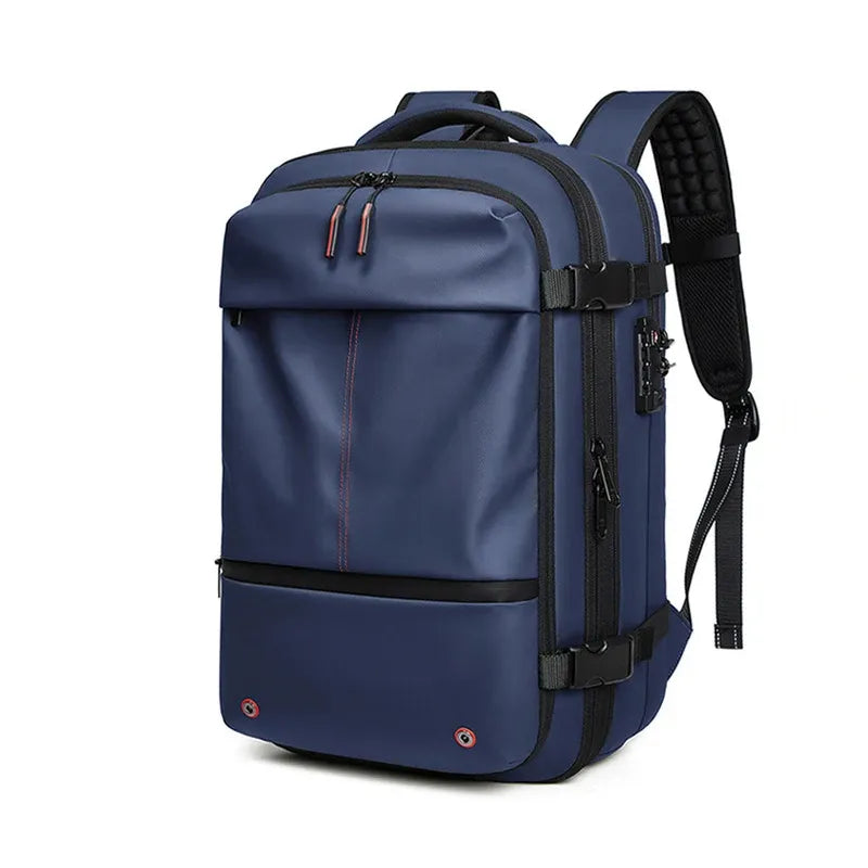 Blue vacuum compression backpack with red accents on a white background