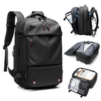 Black vacuum compression backpack with multiple compartments on a white background