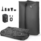 Set of gray vacuum compression travel bags with pump and accessories on a white background